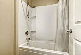 Bathroom with shower, toilet, and sink. Tub and shower repair services available.