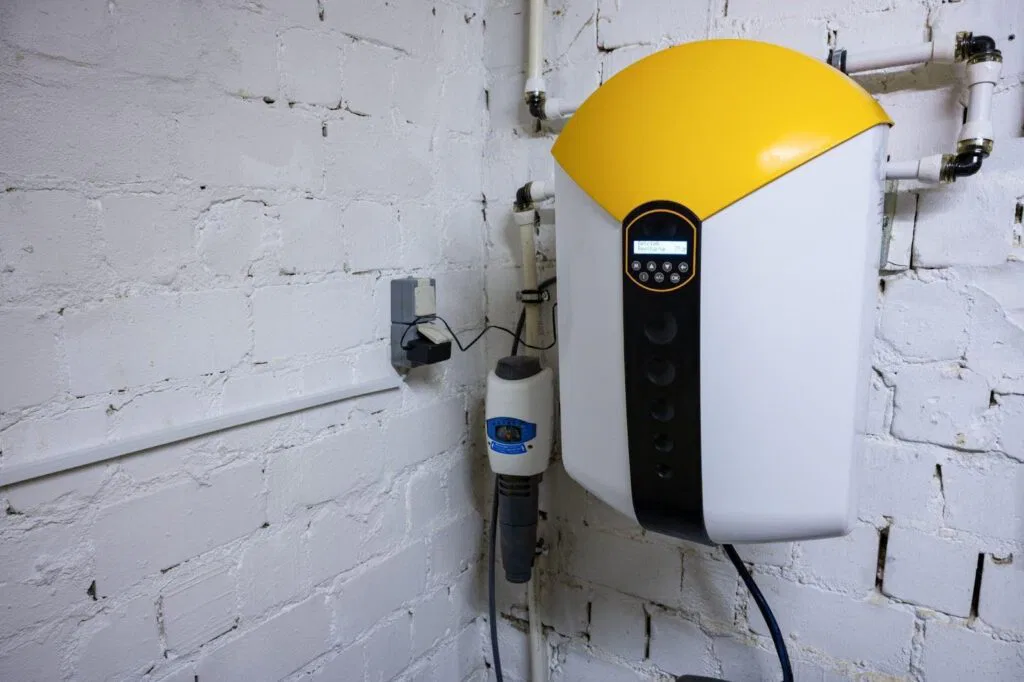 Yellow and black electric water heater on a wall sleek and practical for home heating