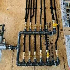 A collection of pipes and hoses neatly arranged on a wooden table.