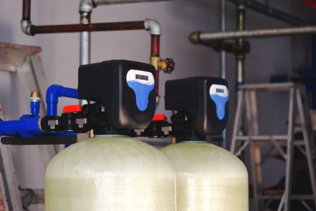 Two water softeners are positioned on a shelf emphasizing their role in improving water quality and softness