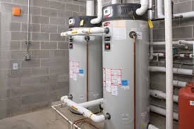 Utility room with a big water heater and pipes.